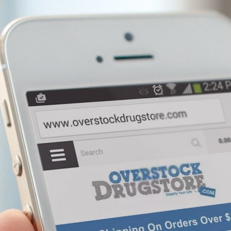 Zoomed in on the Overstock Drugstore website on a mobile phone.